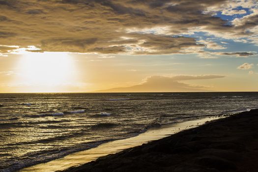 yellow sunset on the beach of south maui