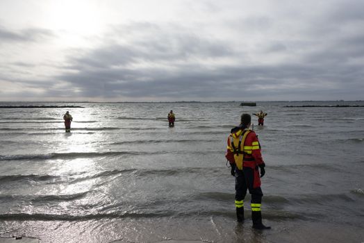 rescue divers checking the water for the new years dip in Holland