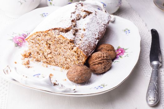 Walnut cake, piece on the plate, close up