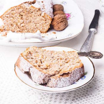 Walnut cake, piece on the plate, close up