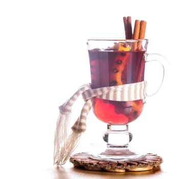 A mulled wine in the glass cup - warming drink