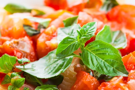 Pasta with sauce from fresh tomatoes and basil, close up