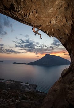 Male rock climber at sunset. Kalymnos Island, Greece