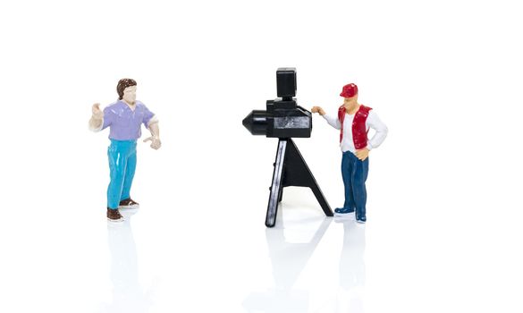 photographer with camera and model isoalted on white