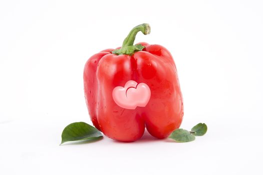 Two hearts on the fresh red paprika, a Valentines Day theme