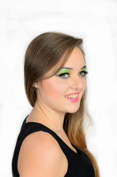 Close up portrait of young female model with blond hairs. Teenager from Poland, smiling face and colorful makeup.