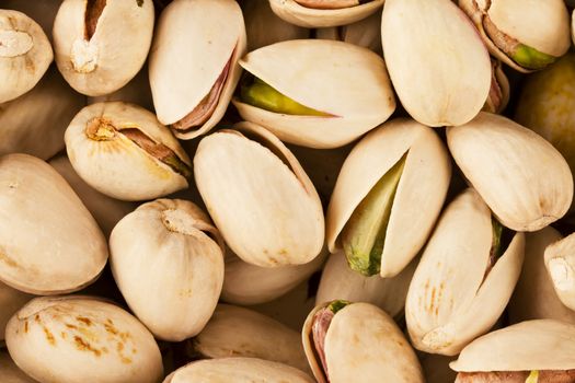 Pistachio nuts close up from above.