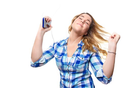 Portrait of beautiful blonde teenager listening music and dancing with a smartphone on white background