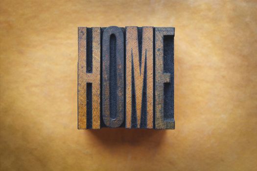 The word HOME written in vintage letterpress type.