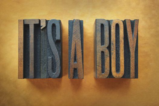 The words IT'S A BOY written in vintage letterpress type.