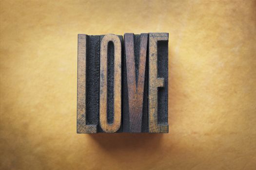 The word LOVE written in vintage letterpress type.