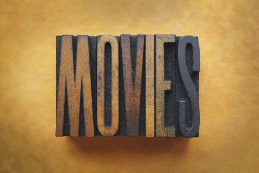 The word MOVIES written in vintage letterpress type.