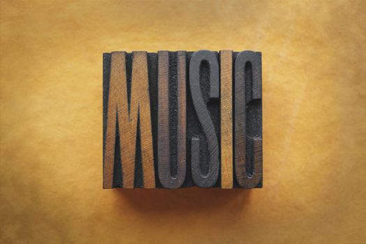 The word MUSIC written in vintage letterpress type.