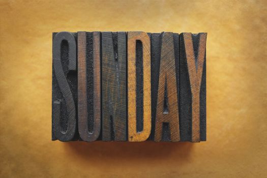 The word SUNDAY written in vintage letterpress type.