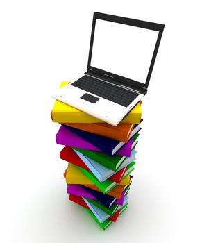 Computer on top of a pile of colored books