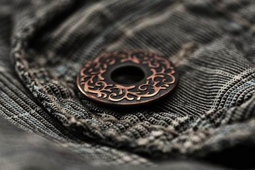 Photo of a pocket jeans with metallic button
