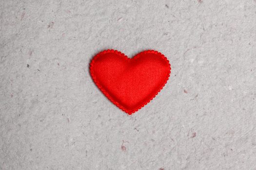 red heart on vintage  paper background with copyspace