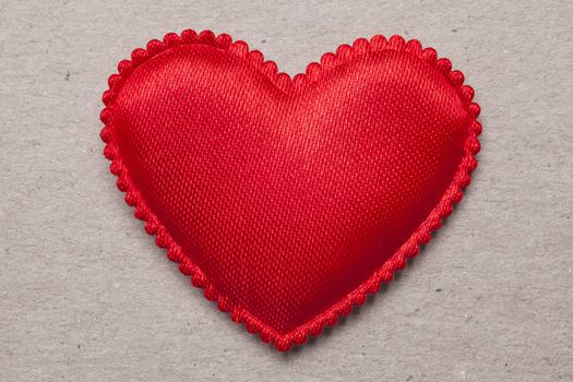 red heart on vintage  paper background with copyspace