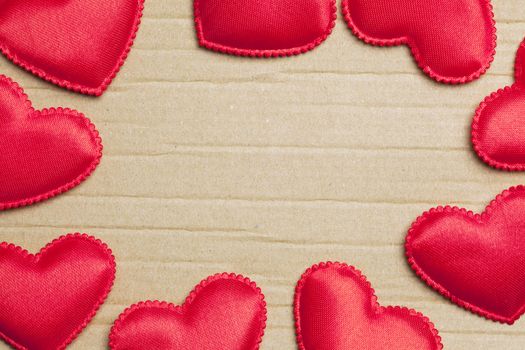 red hearts on vintage  paper background with copyspace