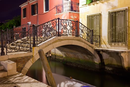 View of beautiful Venetian canal at night, Venice, Italy