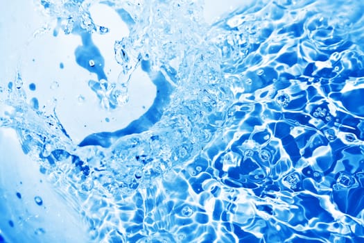 Blue transparent water splashes on white background