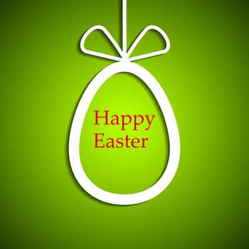 A paper white easter egg on a green background
