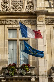 France and European flags on a palace in Paris
