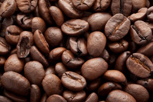 Close-up of brown coffee beans, background texture