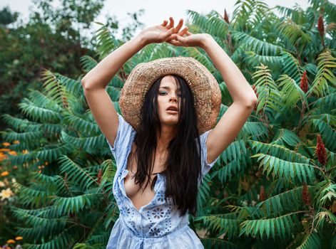 young beautiful nude woman is resting in the garden