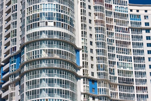 Beautiful view of modern apartment building under blue sky