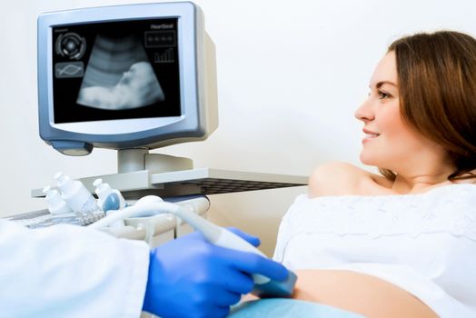 young pregnant woman on the ultrasound, health check