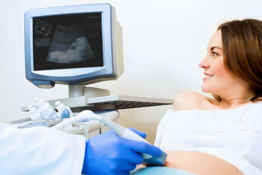 young pregnant woman on the ultrasound, health check