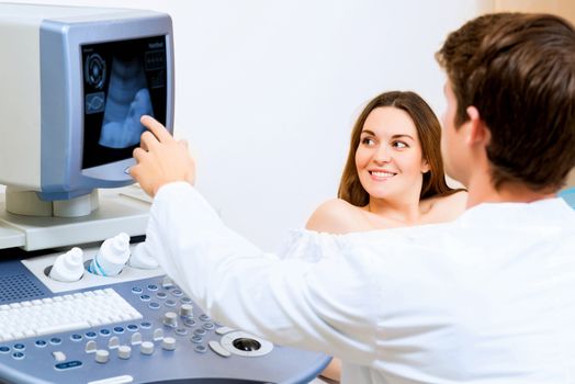 young pregnant woman on the ultrasound, health check