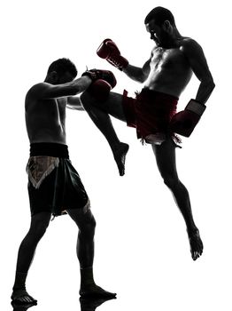 two caucasian men exercising thai boxing in silhouette studio on white background