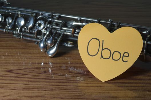 oboe with heart n wood background