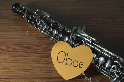 oboe with heart n wood background
