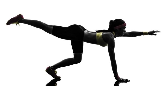 one woman exercising fitness workout in silhouette on white background