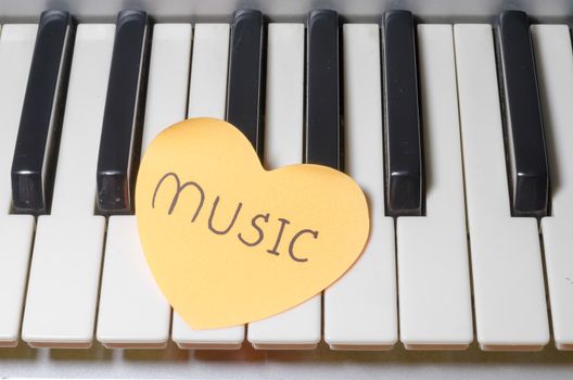 heart on key piano say love music