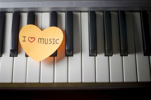 heart on key piano say love music