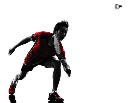 one asian badminton player young man  in silhouette isolated white background