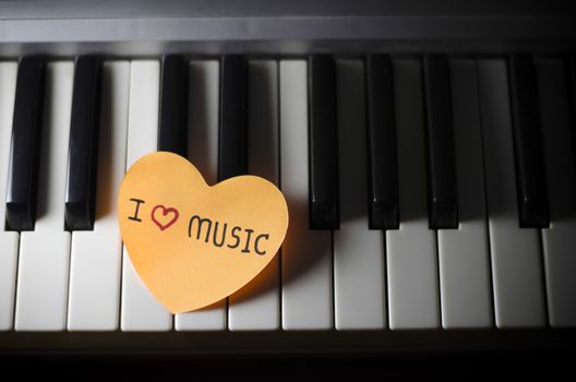 heart on key piano say love music