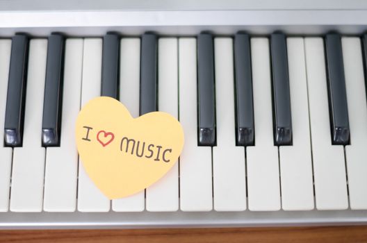 heart on key piano say love music