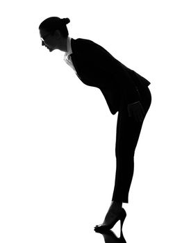 one caucasian business woman saluting bending in silhouette on white background