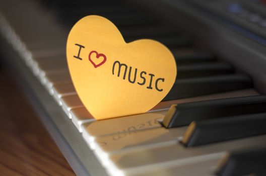 heart on key piano say love music