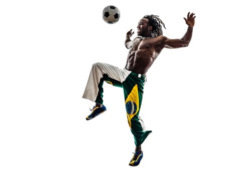 one brazilian black man soccer player juggling football on white background