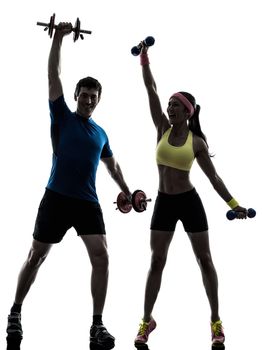 one woman exercising fitness workout with man coach in silhouette on white background