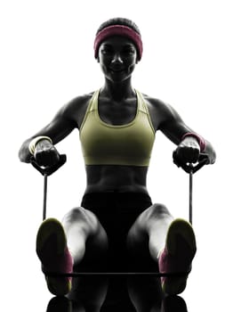 one woman exercising fitness workout resistance bands in silhouette on white background