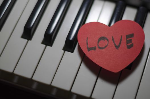 heart on key piano say love music