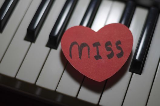 heart on key piano say love music