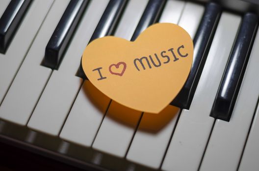 heart on key piano say love music